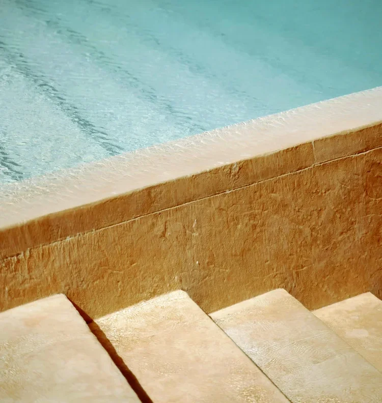 Stone steps leading into a clean pool in San Luis Obispo