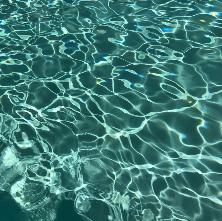 Clear, rippling pool water kept clean with regular service