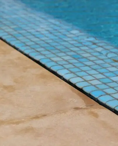 Blue waterline tile along a clean pool edge
