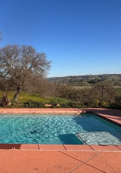 Backyard pool with oak tree and rolling hills near Paso Robles
