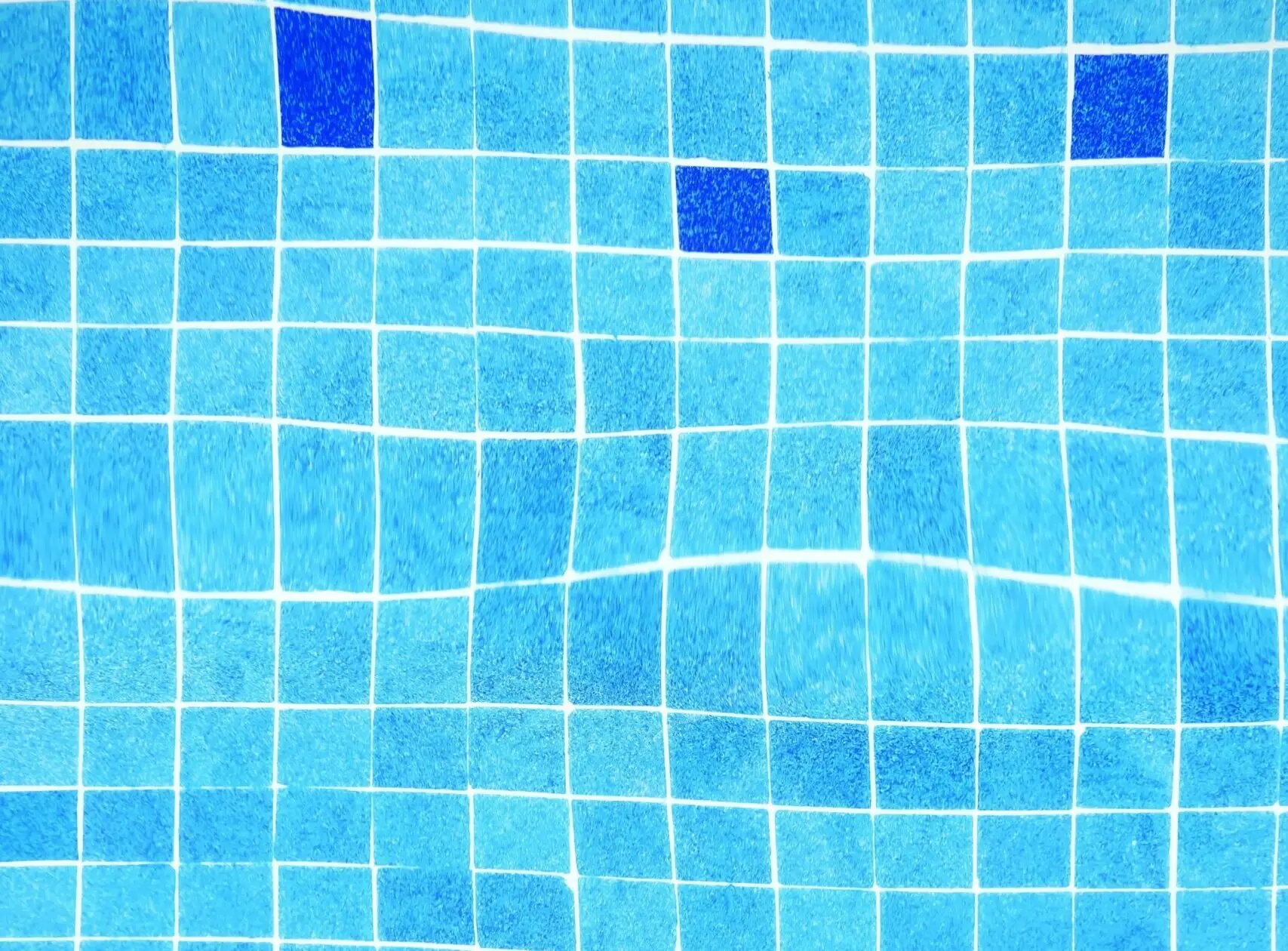 Blue mosaic tile in a commercial pool