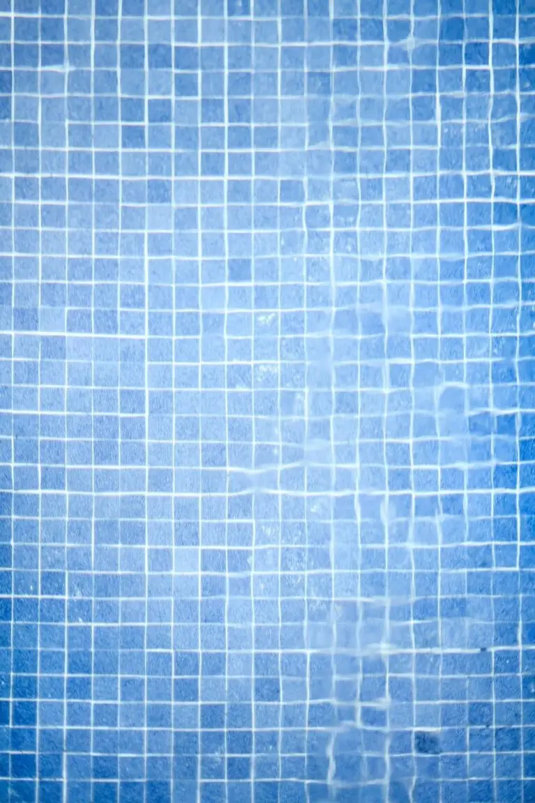 Blue mosaic tile at the pool waterline