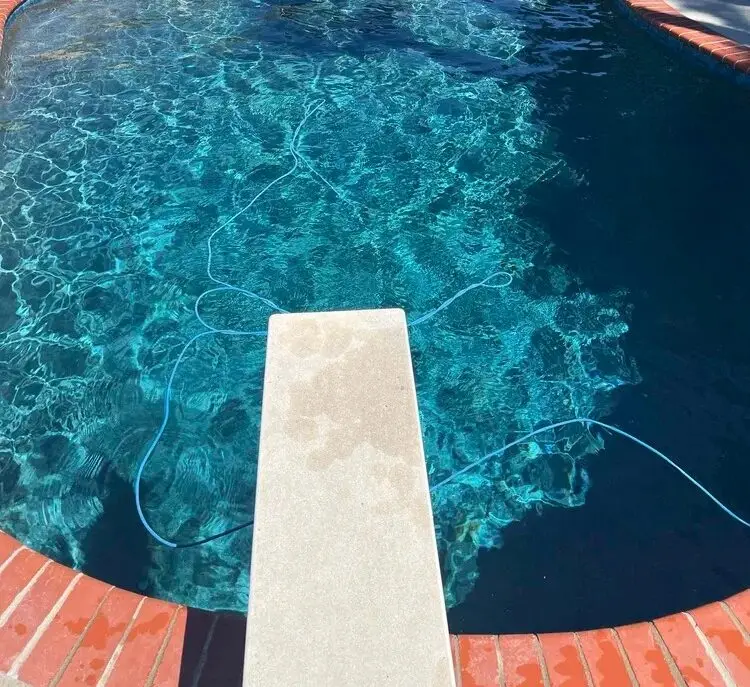 Backyard pool with diving board