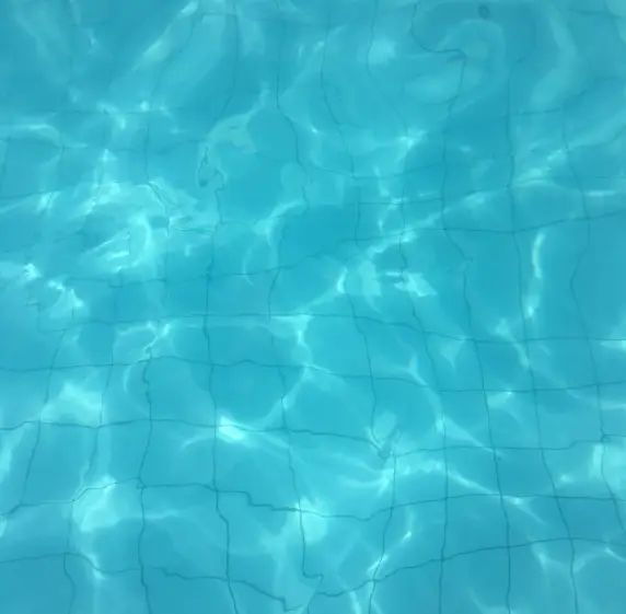 Light patterns dancing across clean pool water