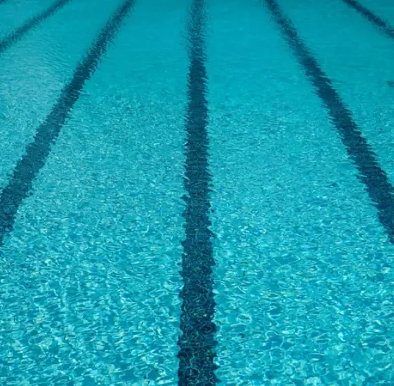 Lap lane lines on the floor of a commercial pool